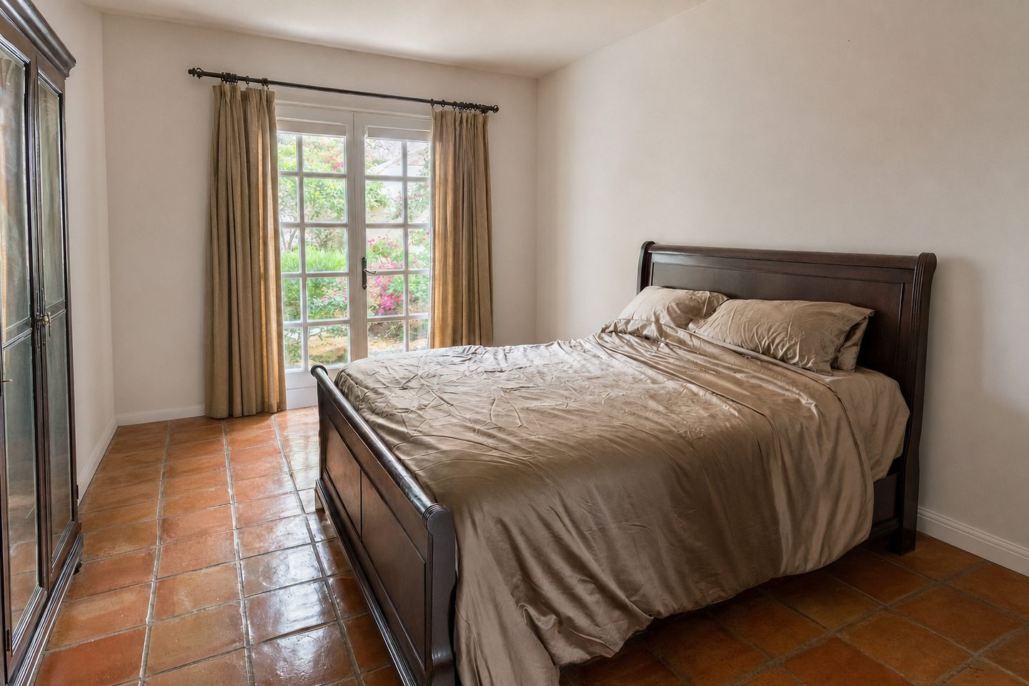 A garden bedroom with French doors — Decluttered