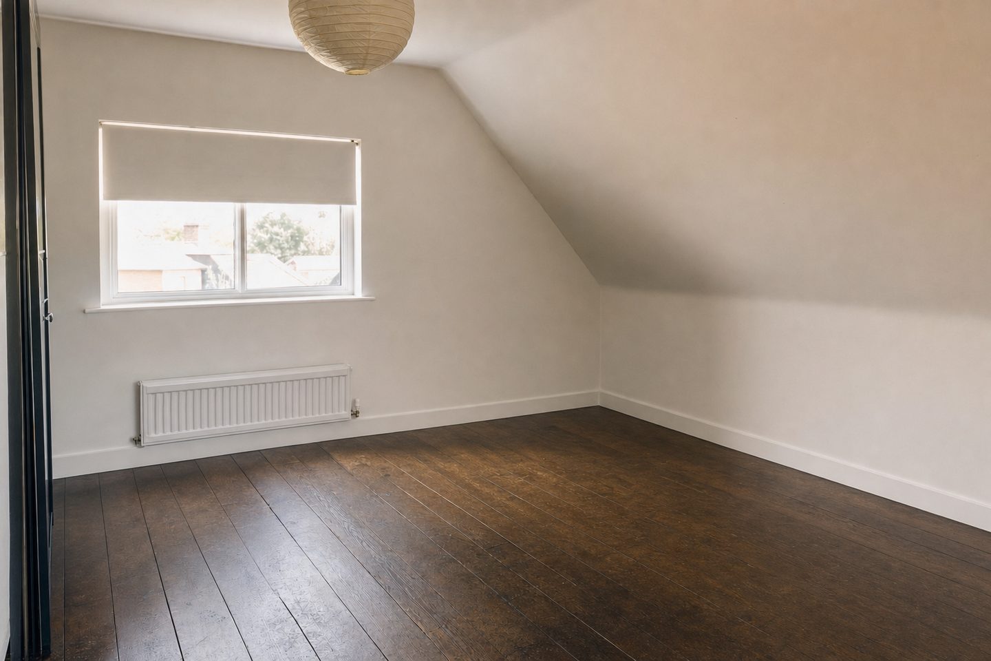An attic bedroom under the slope — Decluttered