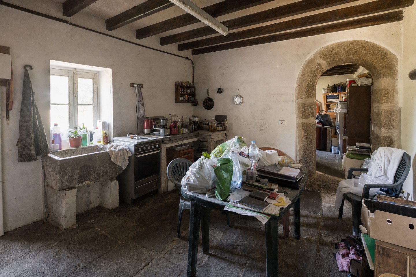 A farmhouse kitchen with a stone arch — Original