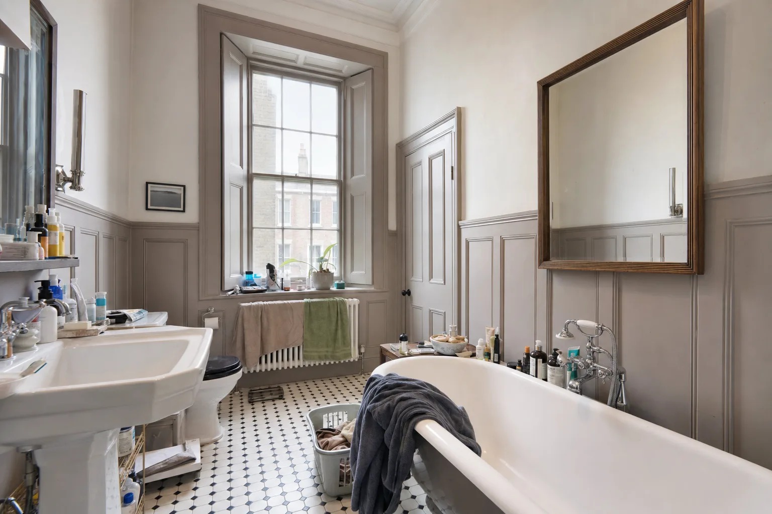 A period house bathroom with a pedestal basin and old shutters — Original